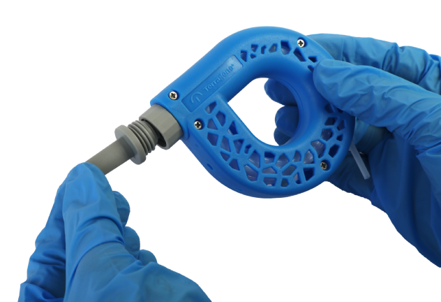 Hands in blue gloves inserting the PCD-A chemical indicator capsule into the Chemdye Helix Plus housing